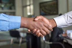 respect - two people shake hands